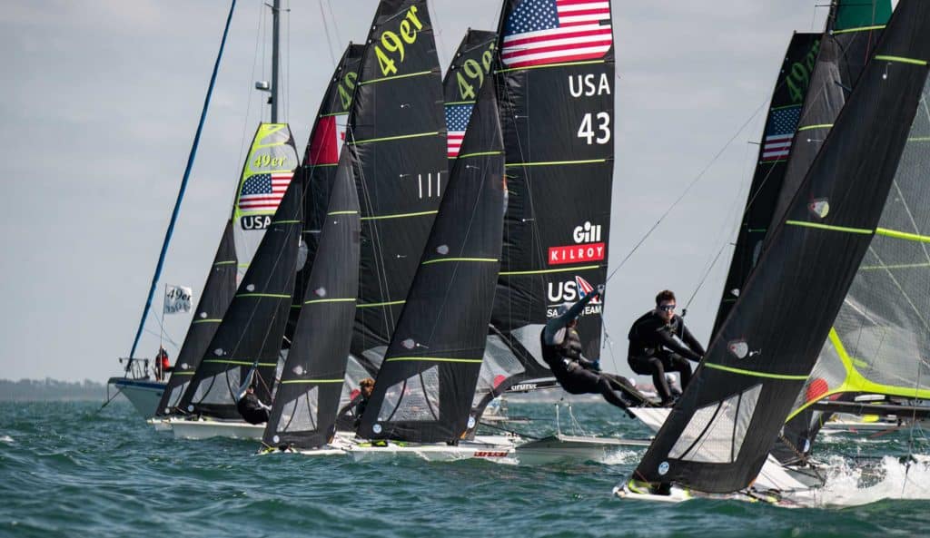 Olympic class 49er sailboats on the starting line of a regatta in Florida